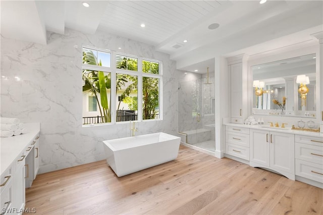 bathroom featuring vanity, hardwood / wood-style flooring, shower with separate bathtub, beam ceiling, and wood ceiling