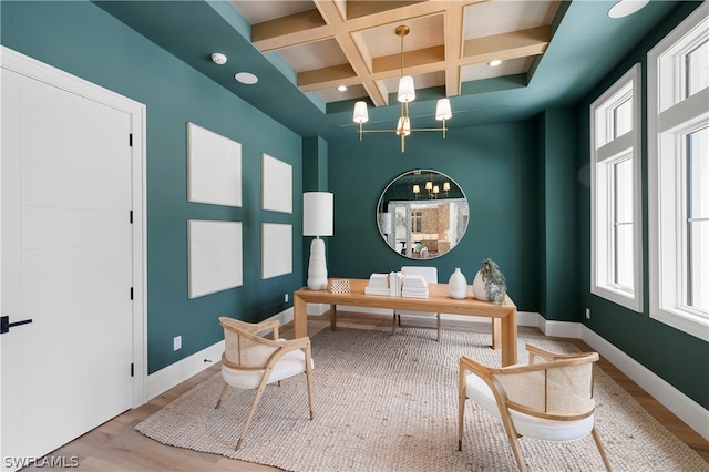 home office featuring beam ceiling, light wood-type flooring, and coffered ceiling