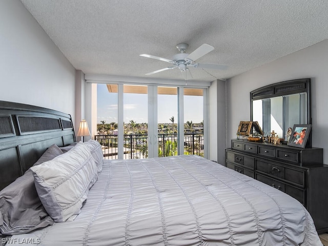 bedroom with access to outside, a textured ceiling, and ceiling fan