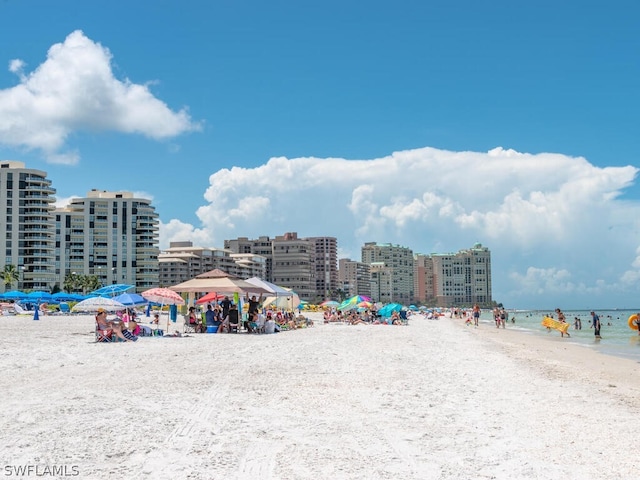 property view of water featuring a beach view