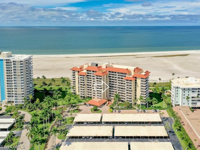 birds eye view of property featuring a view of the beach and a water view