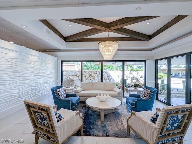 tiled living room featuring an inviting chandelier and a wealth of natural light