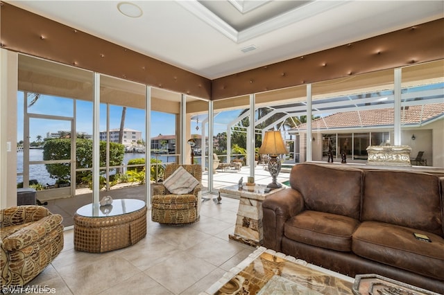 sunroom / solarium featuring a water view