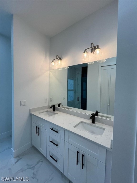 bathroom featuring oversized vanity, dual sinks, and tile flooring