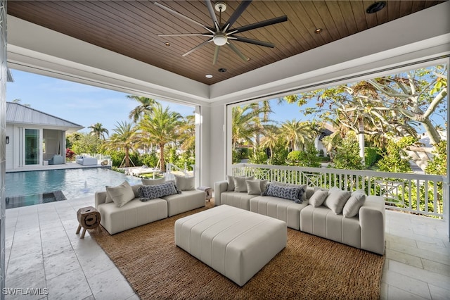 sunroom / solarium with plenty of natural light and wooden ceiling