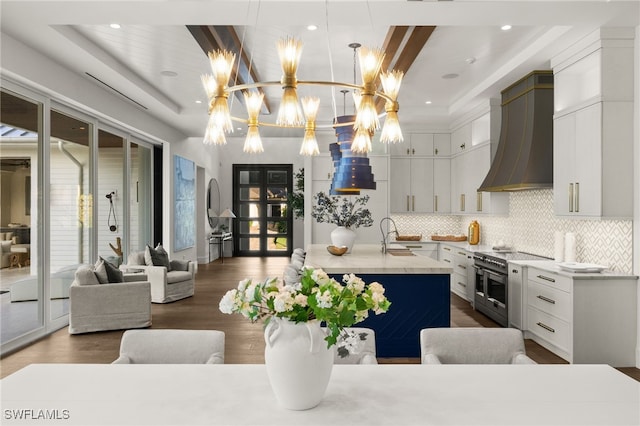 kitchen with white cabinetry, dark wood-type flooring, and high end stainless steel range