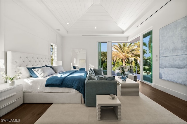 bedroom featuring dark hardwood / wood-style floors, access to exterior, lofted ceiling, and wood ceiling