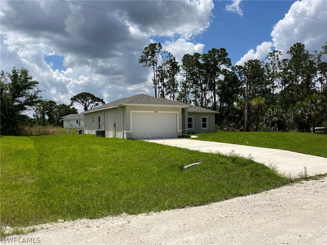 view of front of house featuring a garage and a front lawn