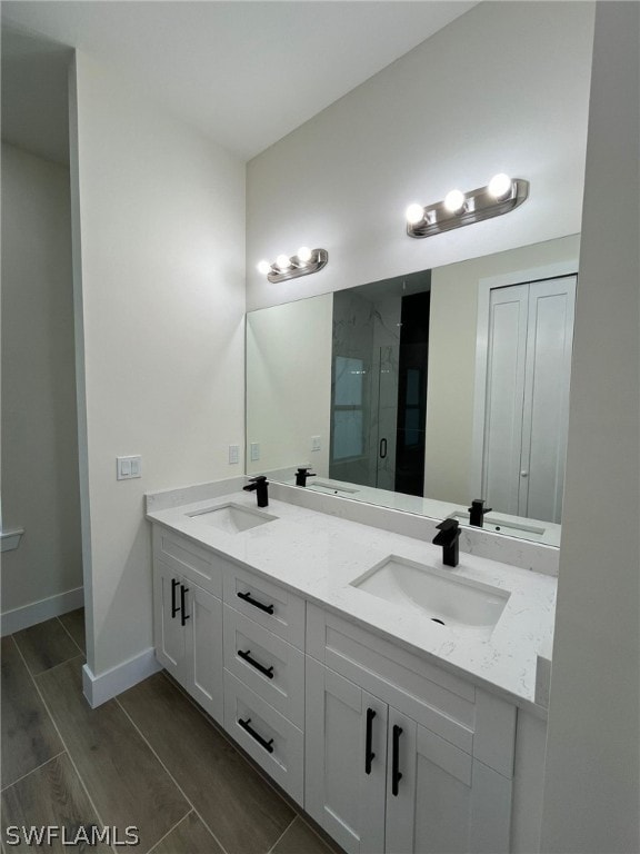 bathroom featuring double vanity