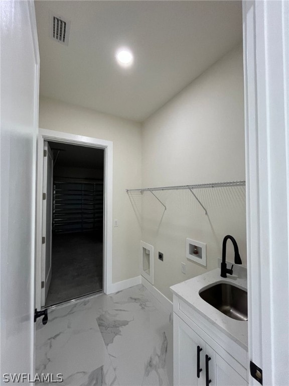 laundry room featuring sink, washer hookup, and hookup for an electric dryer