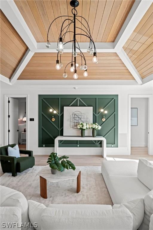 living room featuring vaulted ceiling with beams and wooden ceiling