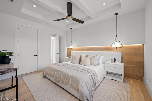 bedroom featuring ceiling fan and light hardwood / wood-style floors