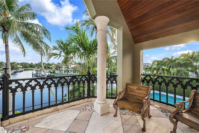 balcony featuring a water view