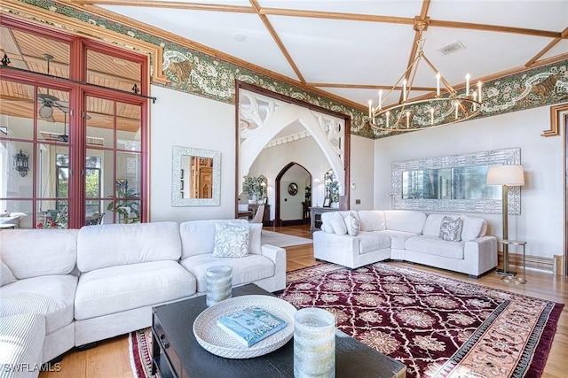 living room with wood-type flooring and a notable chandelier