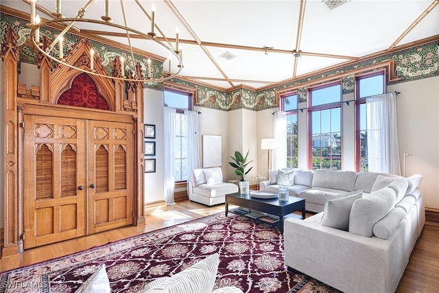 living room featuring hardwood / wood-style flooring and a notable chandelier