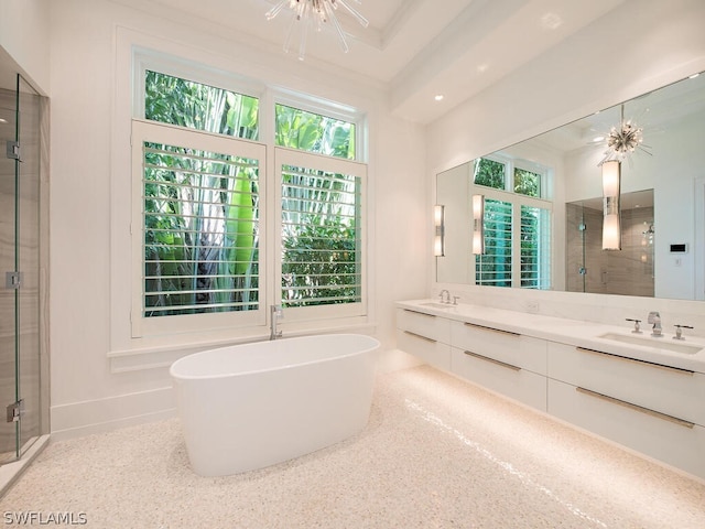 bathroom featuring independent shower and bath, vanity, a healthy amount of sunlight, and ornamental molding