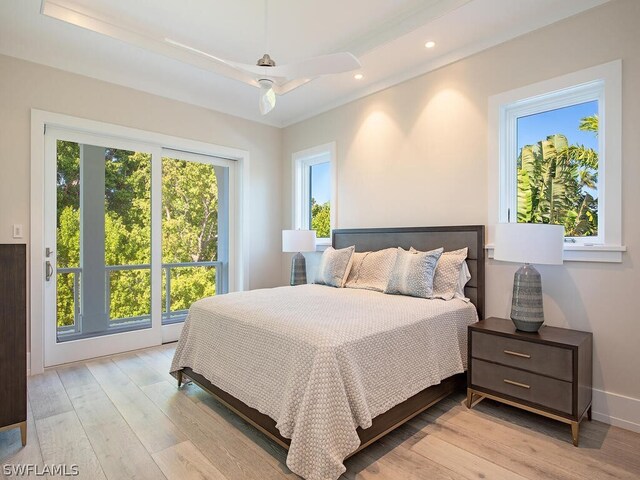 bedroom with ceiling fan and light hardwood / wood-style floors