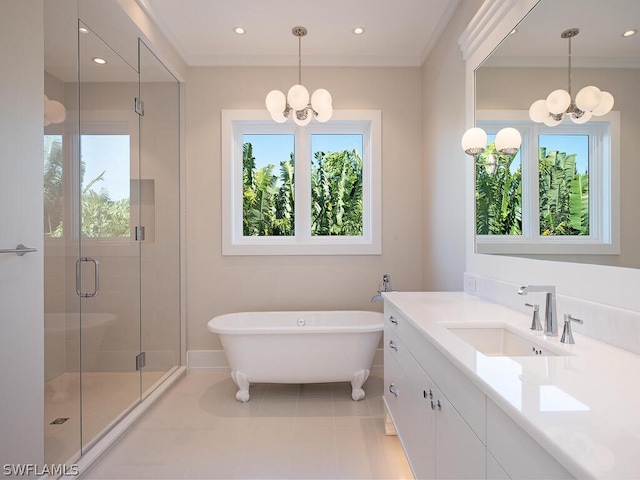 bathroom featuring vanity, separate shower and tub, crown molding, a chandelier, and tile patterned flooring