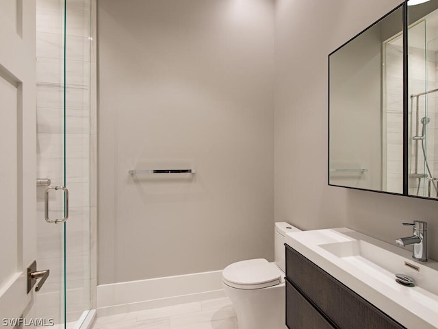 bathroom featuring tile patterned floors, a shower with door, vanity, and toilet