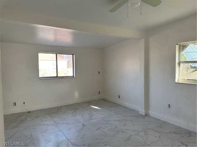 unfurnished room with ceiling fan