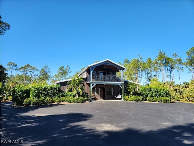 view of front of house with a balcony