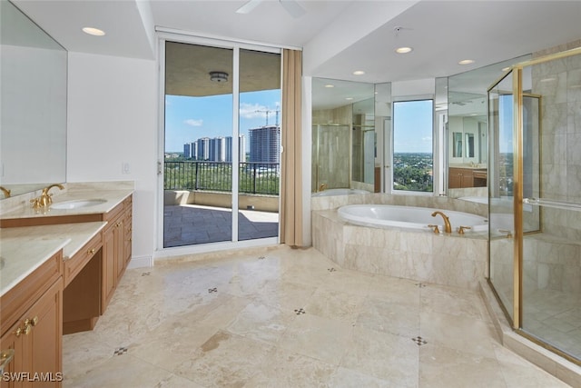 bathroom featuring independent shower and bath, vanity, and ceiling fan