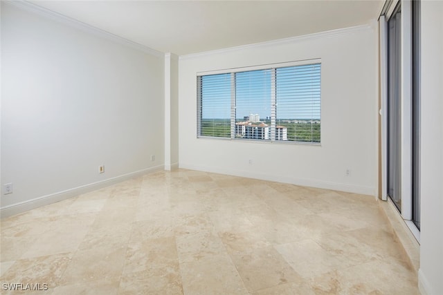 unfurnished room with crown molding