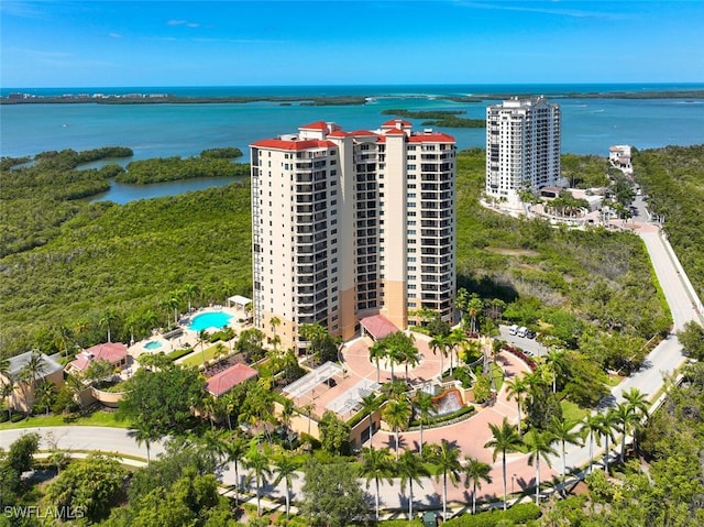 birds eye view of property with a water view