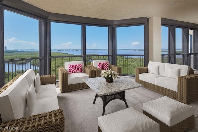 sunroom with a water view