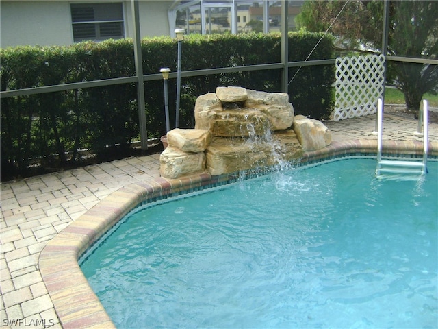 view of pool featuring pool water feature