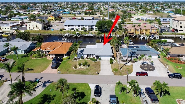 birds eye view of property featuring a water view