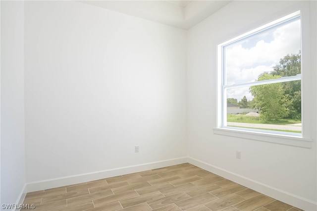 spare room featuring plenty of natural light