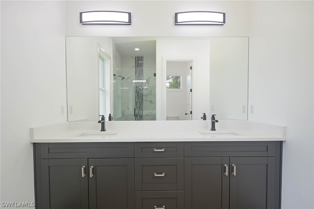 bathroom featuring vanity and an enclosed shower