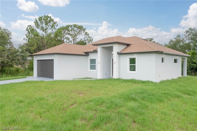 view of front facade with a front lawn and a garage