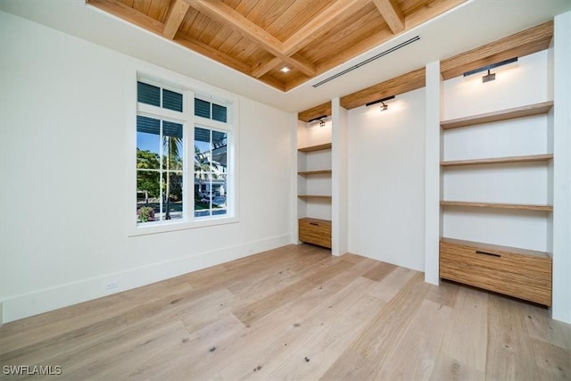 unfurnished bedroom with wood finished floors, wooden ceiling, coffered ceiling, baseboards, and beam ceiling