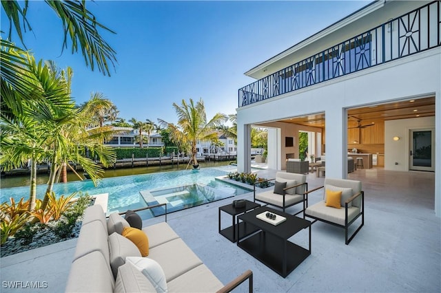 view of swimming pool with an outdoor hangout area, an in ground hot tub, a patio area, and a water view