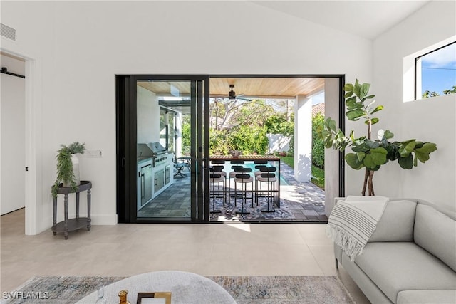 doorway featuring lofted ceiling and visible vents