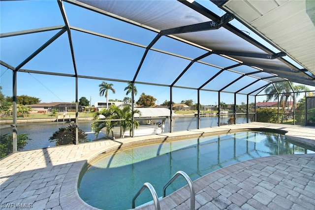 view of swimming pool featuring a patio and a lanai