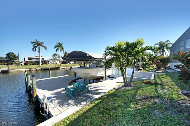 dock area featuring a yard and a water view