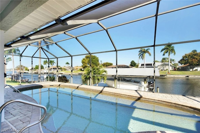 view of pool featuring a boat dock, glass enclosure, and a water view