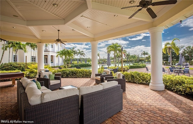 view of patio with an outdoor living space and ceiling fan