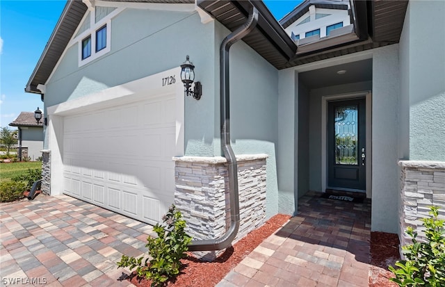 doorway to property featuring a garage