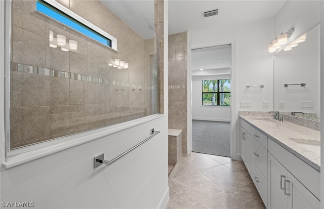 bathroom featuring tile flooring and double vanity