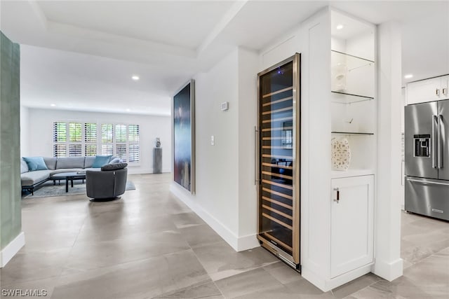 corridor featuring beverage cooler and light tile flooring