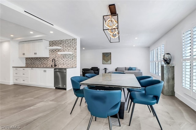 tiled dining space with a notable chandelier and a wealth of natural light