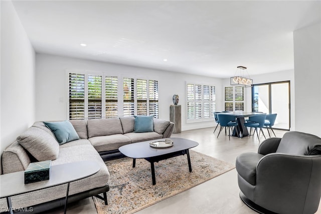 living room with an inviting chandelier