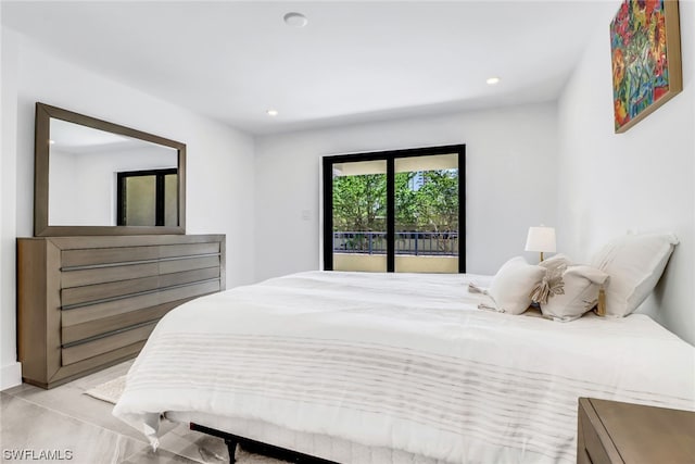 bedroom with access to exterior and light tile floors