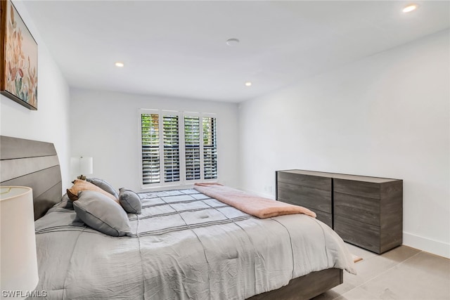 bedroom with light tile floors