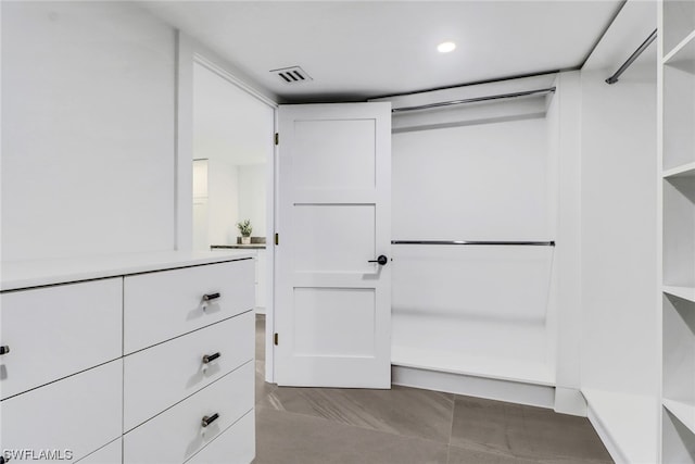 spacious closet featuring light tile flooring