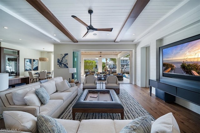 living room featuring beam ceiling, ceiling fan, hardwood / wood-style floors, and wooden ceiling